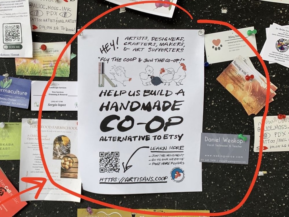 Photo of a busy bulletin board with full-page flyer that says "help us build a handmade co-op alternative to etsy."