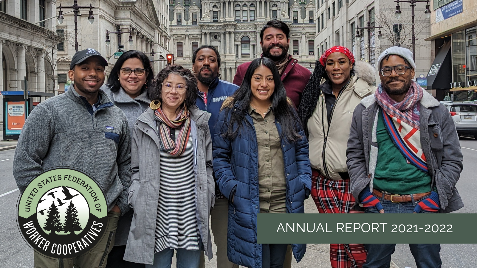 Graphic with a multiracial, multigender group wearing cold weather clothing standing in the middle of a downtown street. Overlaid are the USFWC logo and the words annual report 2021-2022.